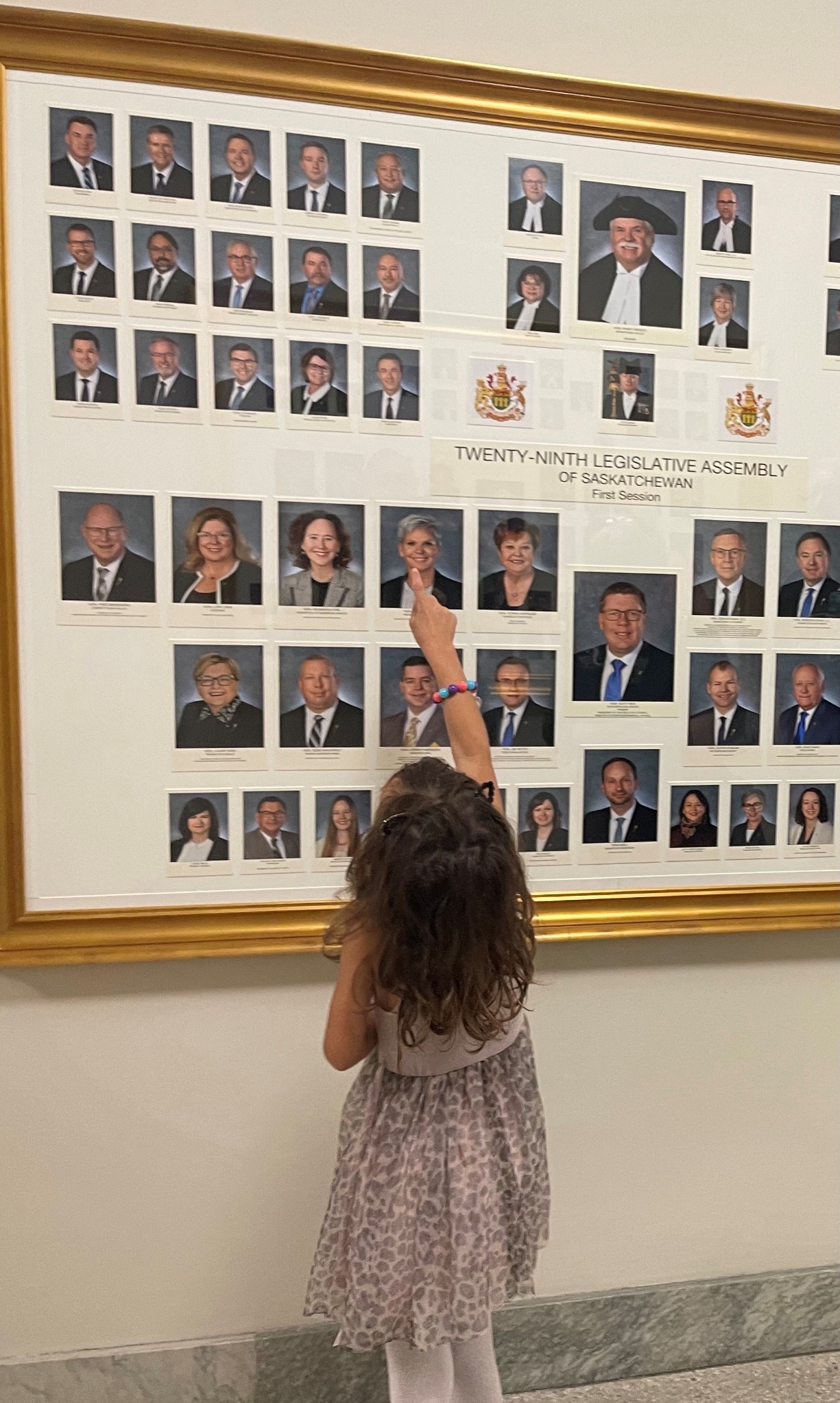 My daughter Kolbie finds my photo at the Legislative Building